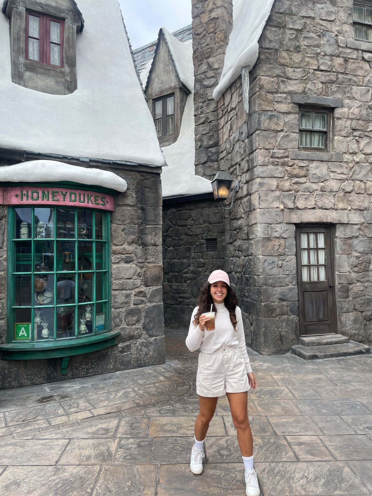 Drinking a butterbeer outside of Honeydukes